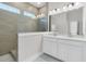 Modern bathroom with double vanity, tile floors, and a large walk-in shower with a tile surround at 810 Gentle Breeze Dr, Summerville, SC 29486
