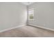 Neutral bedroom features cozy carpeting and a bright window at 810 Gentle Breeze Dr, Summerville, SC 29486