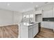 Bright kitchen with white cabinets, stainless steel appliances, and a large island at 810 Gentle Breeze Dr, Summerville, SC 29486