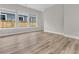 Bright, open living area with wood-look floors and a view of the fenced backyard at 810 Gentle Breeze Dr, Summerville, SC 29486