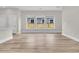 Bright, open floor plan with wood-look floors and large windows for ample natural light at 810 Gentle Breeze Dr, Summerville, SC 29486
