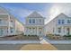 Charming two-story home featuring manicured landscaping and a welcoming front porch at 812 Gentle Breeze Dr, Summerville, SC 29486