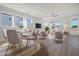Bright and airy living room with dining area, hardwood floors, and modern furnishings at 812 Gentle Breeze Dr, Summerville, SC 29486