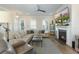 Cozy living room features a fireplace, large sectional sofa, and shiplap accent wall at 836 Forrest Dr, Charleston, SC 29492