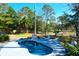 Backyard showcasing a pool, putting green, private dock and marsh views, designed for relaxation and recreation at 886 White Point Blvd, Charleston, SC 29412