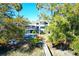 Lush backyard showcasing a pool, dock, and verdant landscaping providing privacy and tranquility at 886 White Point Blvd, Charleston, SC 29412