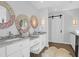 Bright bathroom features double vanity with marble countertops and decorative round mirrors at 886 White Point Blvd, Charleston, SC 29412