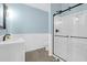 Updated bathroom features wainscotting, glass shower door and a modern vanity at 886 White Point Blvd, Charleston, SC 29412