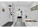 Modern bathroom with a glass-enclosed shower, soaking tub, and decorative tile flooring at 886 White Point Blvd, Charleston, SC 29412