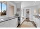 Bright bathroom featuring double vanity with marble countertops, a mini fridge, and natural light at 886 White Point Blvd, Charleston, SC 29412