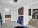 Organized closet with built-in shelving, connecting the bedroom and bathroom areas at 886 White Point Blvd, Charleston, SC 29412