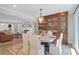 Elegant dining area featuring a charming chandelier and built-in wooden cabinet at 886 White Point Blvd, Charleston, SC 29412