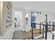 Bright hallway with white wainscoting, showcasing access to bedrooms and a bathroom at 886 White Point Blvd, Charleston, SC 29412