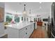 Bright, open kitchen with a large island, pendant lights, and bay window seating at 886 White Point Blvd, Charleston, SC 29412