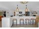 Well-lit kitchen featuring a large island with bar seating and stainless steel appliances at 886 White Point Blvd, Charleston, SC 29412