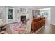 Charming living room featuring a fireplace, hardwood floors, and elegant furnishings at 886 White Point Blvd, Charleston, SC 29412