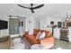 Open-concept living area with a modern kitchen and a stylish leather sofa at 886 White Point Blvd, Charleston, SC 29412