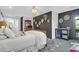 Tranquil main bedroom suite featuring a chandelier, dark accent wall, and beverage cooler at 886 White Point Blvd, Charleston, SC 29412