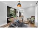Stylish home office featuring a rustic desk, accent chair, and modern decor at 886 White Point Blvd, Charleston, SC 29412