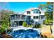 Backyard oasis with private pool, lounge chairs, and a screened porch offering relaxation and entertainment at 886 White Point Blvd, Charleston, SC 29412