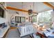 Relaxing screened porch with ceiling fans, hanging swing bed, and inviting lounge furniture at 886 White Point Blvd, Charleston, SC 29412