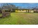 A cozy backyard with a weathered brick chimney, complemented by a lush green lawn at 1024 Locksley Dr, Charleston, SC 29407