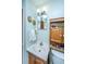 Standard bathroom with oak cabinets, white sink, and plain mirror at 1024 Locksley Dr, Charleston, SC 29407