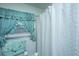 Traditional bathroom with patterned shower curtain and matching window curtain at 1024 Locksley Dr, Charleston, SC 29407