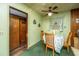 Eat-in kitchen with retro green walls, ceiling fan, and wood accents at 1024 Locksley Dr, Charleston, SC 29407