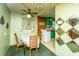 View of the eat-in kitchen with an adjacent laundry area and green walls at 1024 Locksley Dr, Charleston, SC 29407