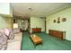 Open living space showcasing retro furnishings, connecting living and dining areas at 1024 Locksley Dr, Charleston, SC 29407