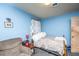 Blue main bedroom shows a bed, side table, and a chair at 1024 Locksley Dr, Charleston, SC 29407