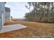 View of backyard with a patio and a view to the woods at 1058 Marsh Harrier Dr # 15-7P, Ravenel, SC 29470
