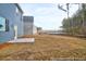 View of the backyard of new home construction with pond and trees at 1058 Marsh Harrier Dr # 15-7P, Ravenel, SC 29470