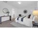 Bright bedroom with a large bed, stylish decorations, and ensuite bathroom access at 1058 Marsh Harrier Dr # 15-7P, Ravenel, SC 29470