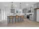 Charming kitchen featuring gray cabinets, stainless steel appliances, a center island, and stylish pendant lighting at 1058 Marsh Harrier Dr # 15-7P, Ravenel, SC 29470