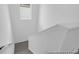 Carpeted staircase featuring white walls, offering a clean and minimalist aesthetic at 1058 Marsh Harrier Dr # 15-7P, Ravenel, SC 29470