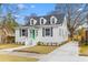 Charming two-story home with a freshly painted exterior, dormer windows, and a welcoming green front door at 104 Darlington Ave, Charleston, SC 29403