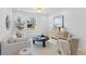 Bright living room with modern furniture, stylish decor, and natural light streaming through the window at 104 Darlington Ave, Charleston, SC 29403