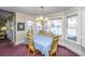 Cozy dining room with views of the water, chandelier, and ample natural light at 105 Goose Creek Dr, Goose Creek, SC 29445