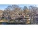 Scenic lakefront home with mature mossy trees and reflective water at 105 Goose Creek Dr, Goose Creek, SC 29445