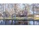 Charming lakefront home with mossy trees and inviting water views at 105 Goose Creek Dr, Goose Creek, SC 29445