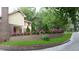 Charming home with landscaped front yard, retaining wall, and manicured lawn at 105 Goose Creek Dr, Goose Creek, SC 29445