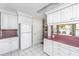 Well-lit kitchen with white cabinets, stainless steel appliances, and tiled floor at 105 Goose Creek Dr, Goose Creek, SC 29445