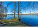 Expansive lake view framed by cypress trees, offering a serene and picturesque natural landscape at 105 Goose Creek Dr, Goose Creek, SC 29445