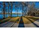 Serene water view showcasing a tranquil lake framed by trees, creating a peaceful and natural ambiance at 105 Goose Creek Dr, Goose Creek, SC 29445