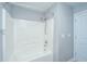 A clean white bathtub and shower combination with a grey wall and white door at 106 Willet Dr, Summerville, SC 29485