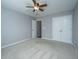 Neutral bedroom showcasing carpet, ceiling fan, and a large closet at 106 Willet Dr, Summerville, SC 29485