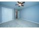 A bright bedroom with a closet and doorway, carpeted floors, and light blue walls at 106 Willet Dr, Summerville, SC 29485