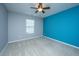 Bedroom featuring a neutral and teal accent wall, carpet, and a window at 106 Willet Dr, Summerville, SC 29485